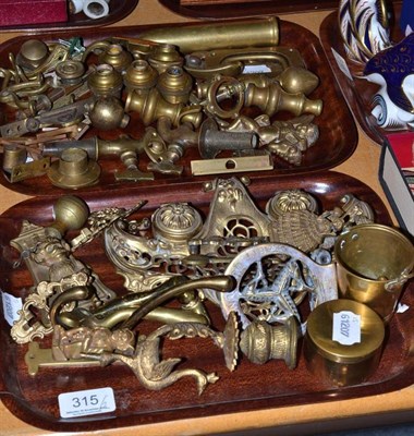 Lot 315 - Brass door knockers and fittings (on two trays)