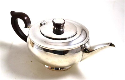 Lot 319 - Squat melon shaped teapot by Hollins and Hutchinson, Birmingham, 1934, with a fibre handle