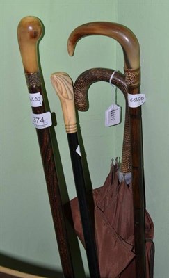 Lot 374 - Three canes and a Fox & Co umbrella