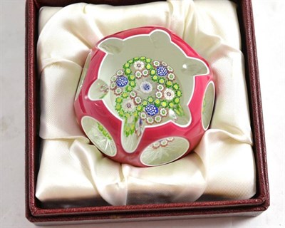 Lot 377 - A 1982 Whitefriars ruby double-overlay paperweight by Colin Terris, with box and certificate