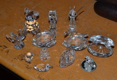 Lot 394 - A collection of Swarovski ornaments including candlesticks, swans etc