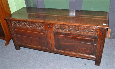 Lot 465 - A 17th century oak coffer with carved frieze