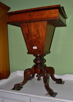 Lot 469 - A Victorian sewing table raised on three carved feet