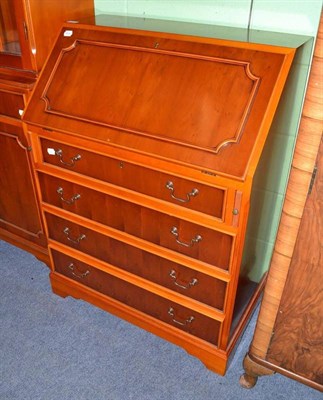 Lot 475 - A reproduction yew wood bureau