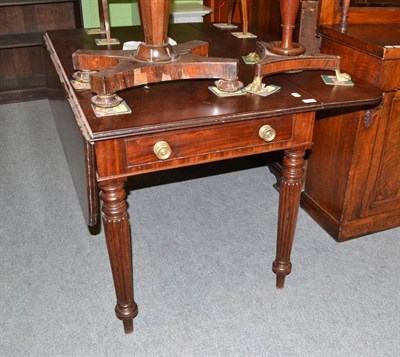 Lot 487 - A Regency mahogany Pembroke table with reeded legs and brass furniture