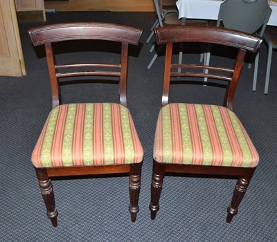 Lot 505 - A set of four George IV bar back dining chairs with reeded legs