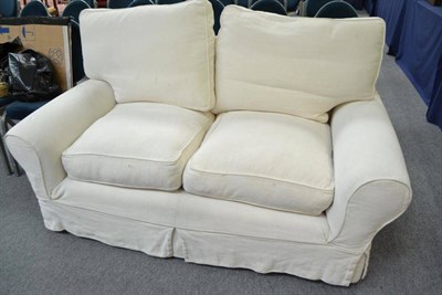 Lot 506 - A modern cream upholstered sofa