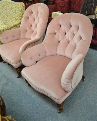 Lot 515 - A pair of Victorian walnut button back easy chairs