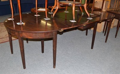 Lot 520 - A George III mahogany D-end dining table, with three additional leaves, length 276cm