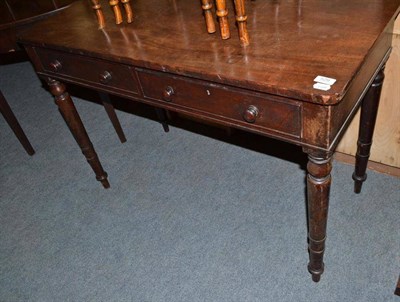 Lot 529 - Mahogany two drawer writing table