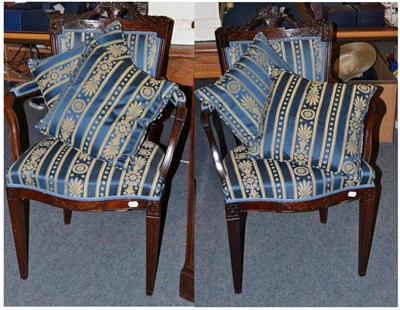 Lot 561 - Two upholstered armchairs and four cushions