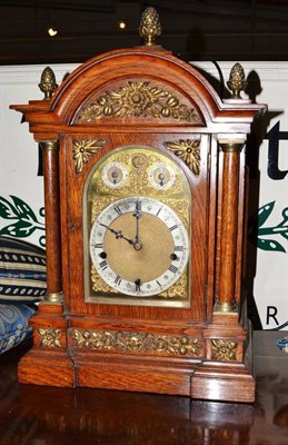 Lot 562 - An oak cased table clock, movement now converted to electric (a.f.)