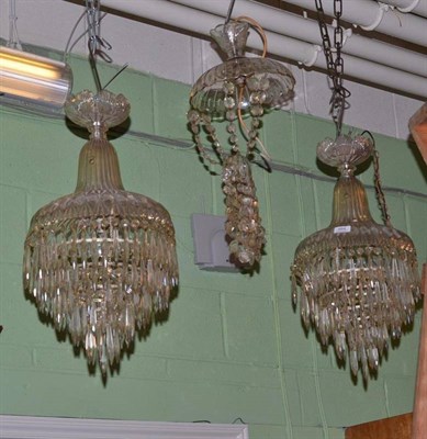 Lot 564 - A pair of early 20th century cut and moulded glass basket chandeliers and another