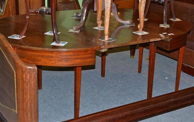 Lot 569 - A 19th century mahogany dining table