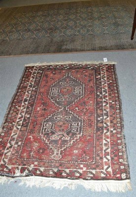 Lot 587 - Bukhara carpet, Lahore Punjab, the diamond lattice field of hooked guls enclosed by multiple...