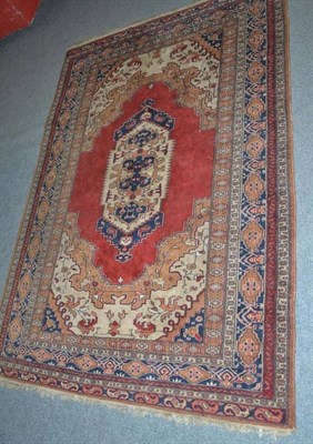 Lot 588 - Ardabil rug, North West Persia, the tomato field with stepped indigo lozenge medallion framed...