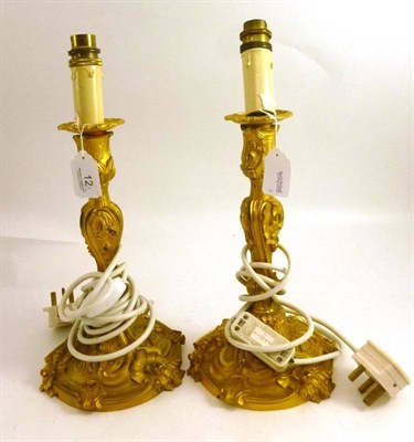 Lot 12 - A pair of gilt metal lamps