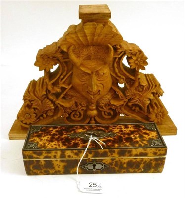 Lot 25 - A faux tortoiseshell glove box with steel mounts and a carved wood Green Man