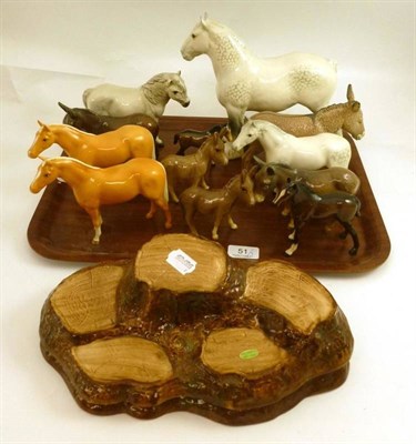 Lot 51 - A collection of Beswick horses, foals, donkeys and two stands