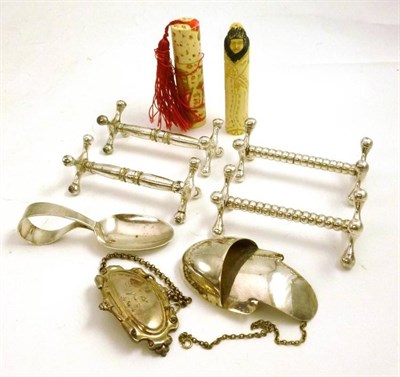 Lot 64 - Silver baby's spoon, four knife rests, decanter label, two scent bottle holders etc