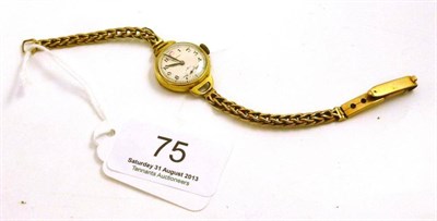 Lot 75 - A lady's 18ct gold Longines wristwatch with attached 9ct gold bracelet