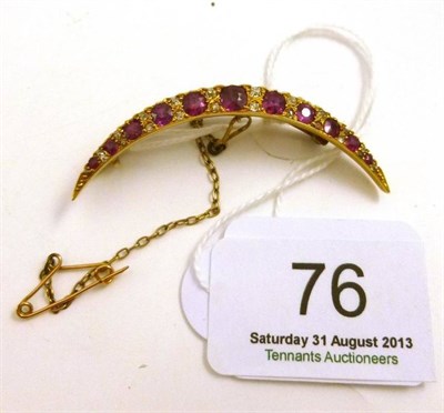 Lot 76 - A ruby and diamond set crescent brooch