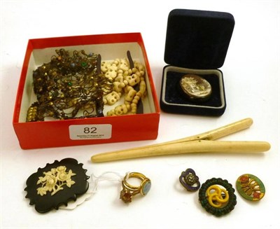 Lot 82 - A hair pin, two jet brooches (both a.f.), a woven and jewelled hair piece, two dress rings,...