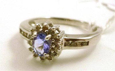 Lot 96 - A 9ct white gold tanzanite and diamond cluster ring