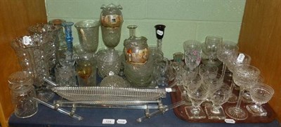 Lot 124 - A shelf of decorative clear glassware including press moulded celery vases and a pair of small...