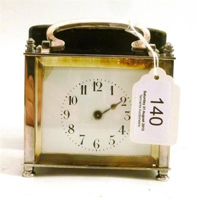 Lot 140 - A silver plated carriage clock, cased