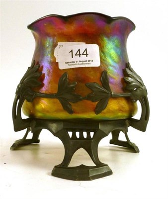 Lot 144 - A iridescent Loetz style glass bowl on an Art Nouveau pewter stand