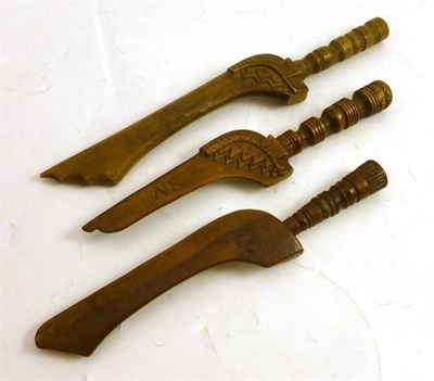 Lot 152 - Three fruitwood knitting sheaths