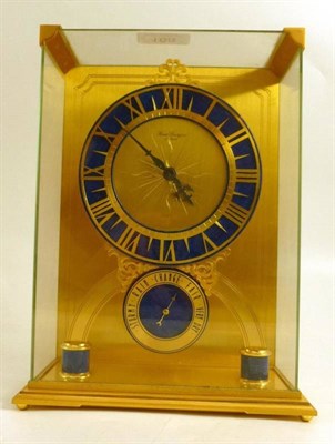 Lot 168 - A gilt brass and faux lapis timepiece with combined aneroid barometer