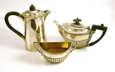 Lot 171 - A silver teapot and sugar bowl, bachelor size and a hot water jug (3)