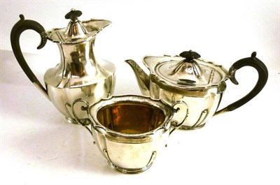 Lot 172 - A silver three piece tea service, various dates, comprising hotwater jug, teapot and sugar bowl (3)