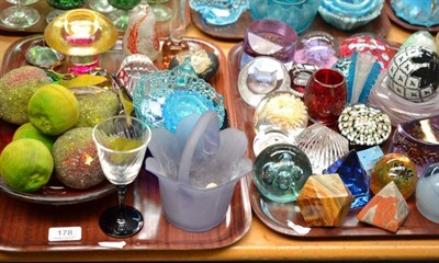 Lot 178 - Three trays of fancy glass paperweights, fruits, small vases and a pottery carpet bowl