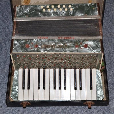 Lot 205 - A cased accordion