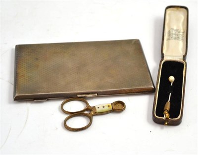 Lot 213 - A silver cigarette case, a stick pin and cigar cutter