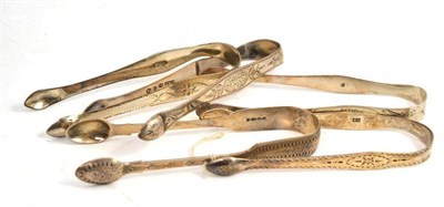 Lot 232 - Five pairs of Georgian silver sugar tongs