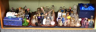 Lot 239 - A shelf of decorative glass perfume bottles