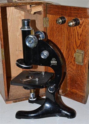 Lot 242 - A Beck microscope in an oak case