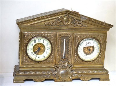 Lot 243 - A brass compendium mantel timepiece