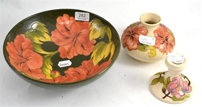 Lot 282 - A Moorcroft bowl, vase and a squat candlestick