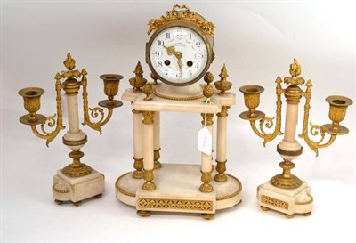 Lot 295 - A French clock garniture, key and pendulum