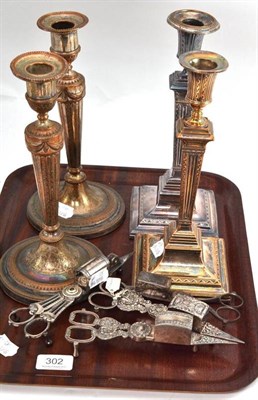 Lot 302 - Two pairs of plate on copper candlesticks and four pairs of scissor wick trimmers