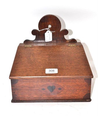 Lot 308 - An oak candle box with hinged lid