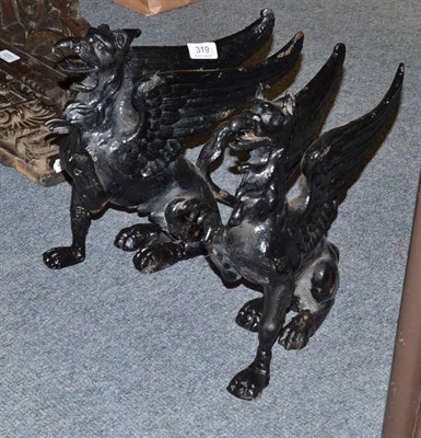 Lot 319 - Pair cast iron griffins