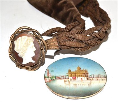 Lot 328 - A cameo set woven hair and brown velvet choker and a miniature on ivory depicting an Indian...