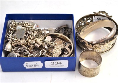 Lot 334 - A quantity of silver jewellery including two charm bracelets, brooches, gate link bracelet,...