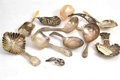 Lot 336 - A mother of pearl and silver filigree caddy spoon, and nine various Georgian and later caddy spoons